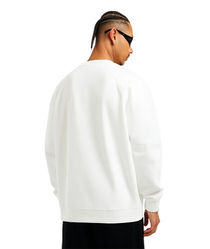 Person wearing a white sweatshirt on a transparent background