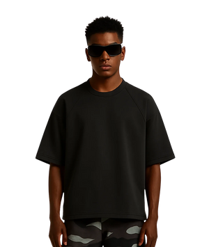 Person wearing a black t-shirt and sunglasses on a white background