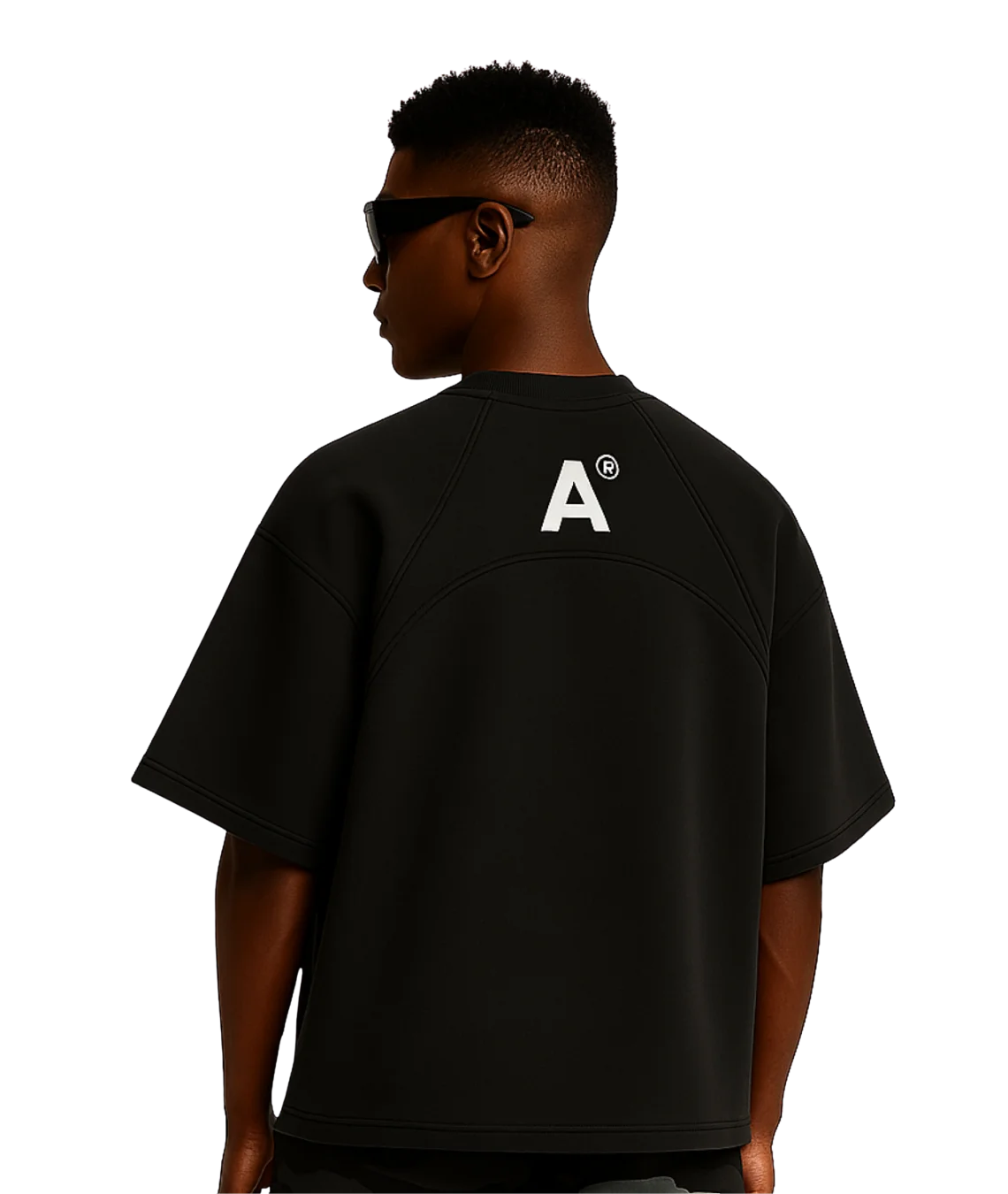 Person wearing a black t-shirt with a logo on the back against a white background