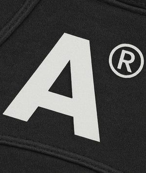 Black fabric with a large white letter 'A' and a registered trademark symbol.