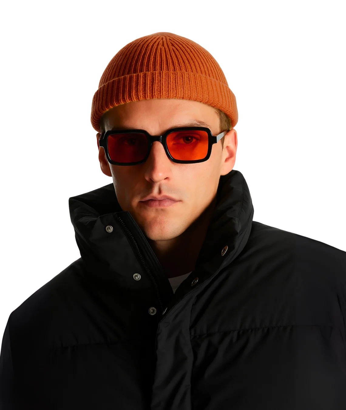 A man wearing a ribbed orange beanie, black sunglasses with orange-tinted lenses, and a black puffer jacket, photographed against a solid white background.