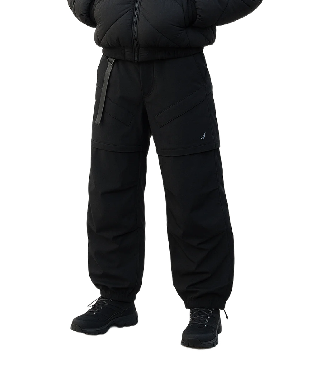 Person wearing a black snowsuit on a white background