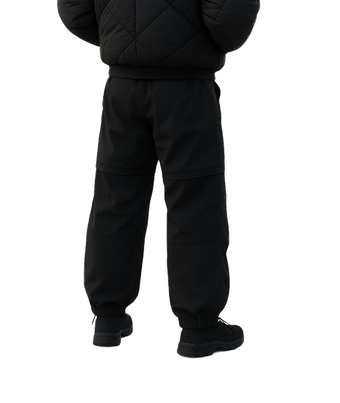 Person wearing a black puffer jacket and pants on a white background