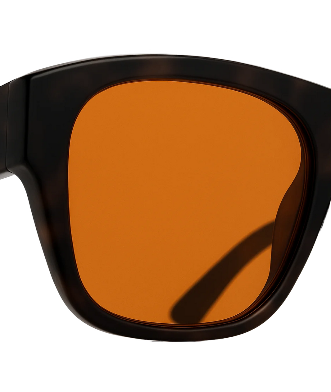 Close-up of oversized square sunglasses with a dark tortoiseshell frame and a warm amber-orange lens, shown against a plain white background.