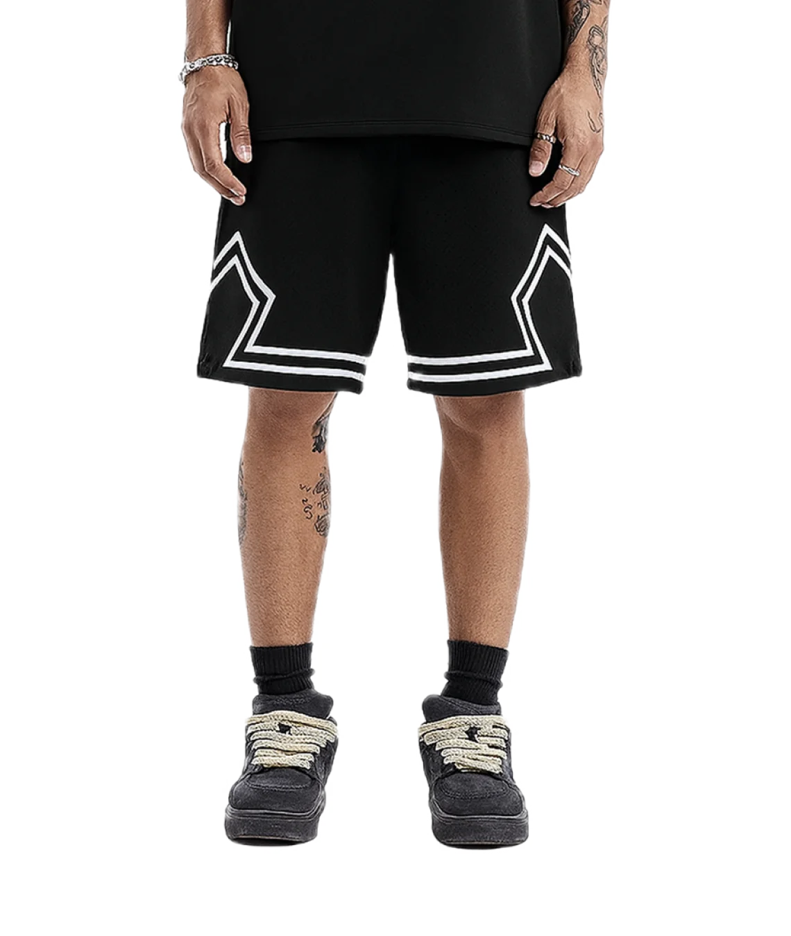 Person wearing black shorts with white geometric designs on a white background