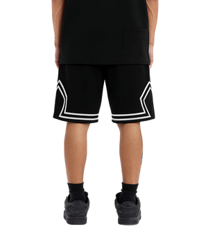 Person wearing black shorts with white trim on a transparent background