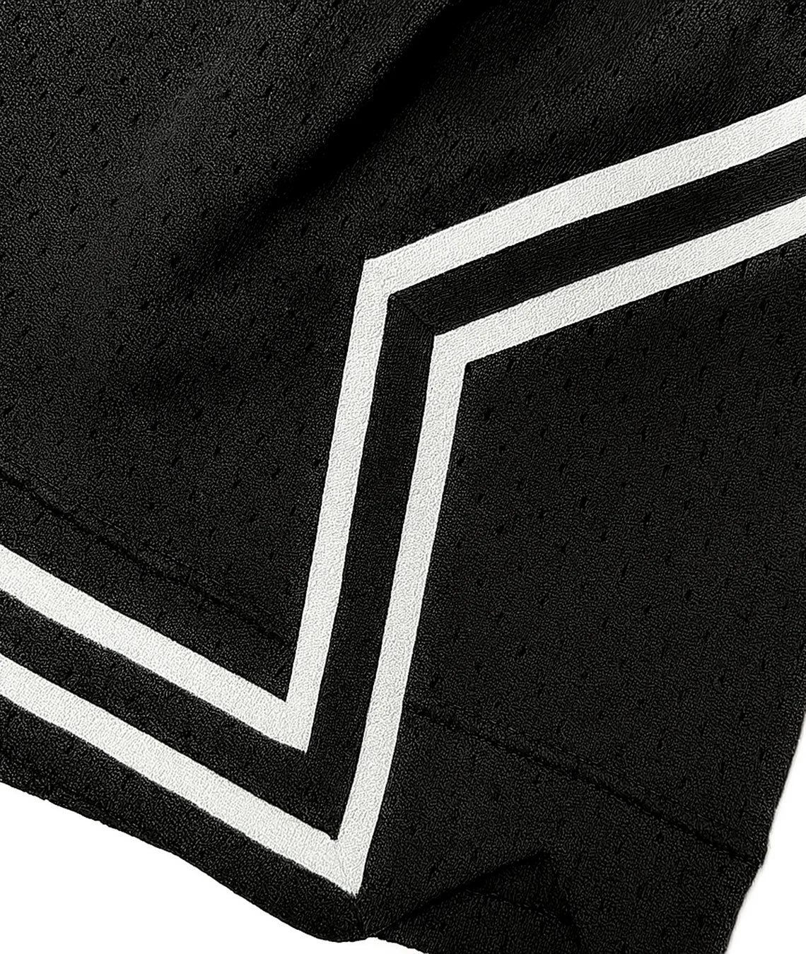Close-up of a black garment with white stripes on a white background