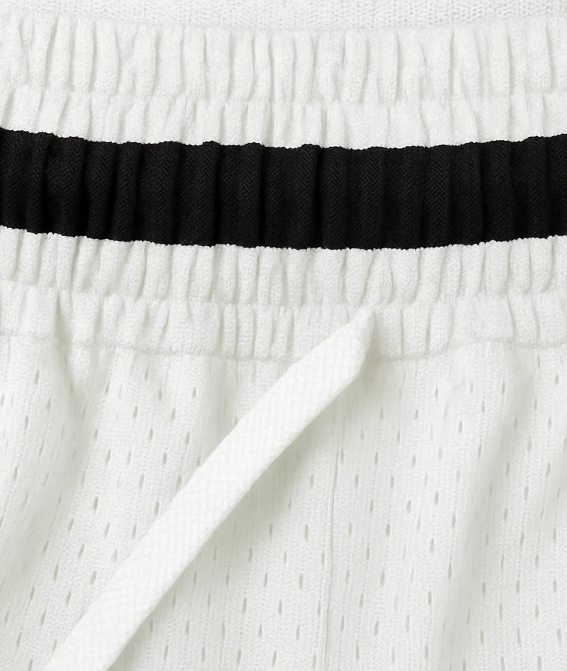 Close-up of white fabric with a black band at the top