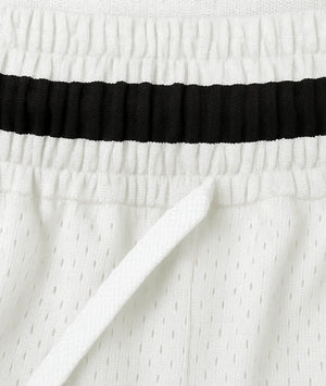 Close-up of white fabric with a black band at the top