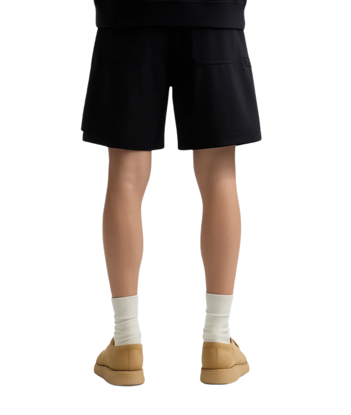 Person wearing black shorts, white socks, and tan shoes on a white background