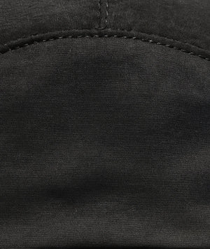 Close-up of black fabric with stitching detail