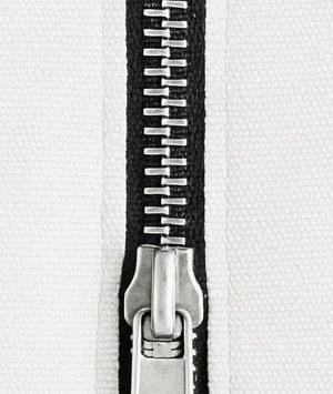 Close-up of a metal zipper on a white background