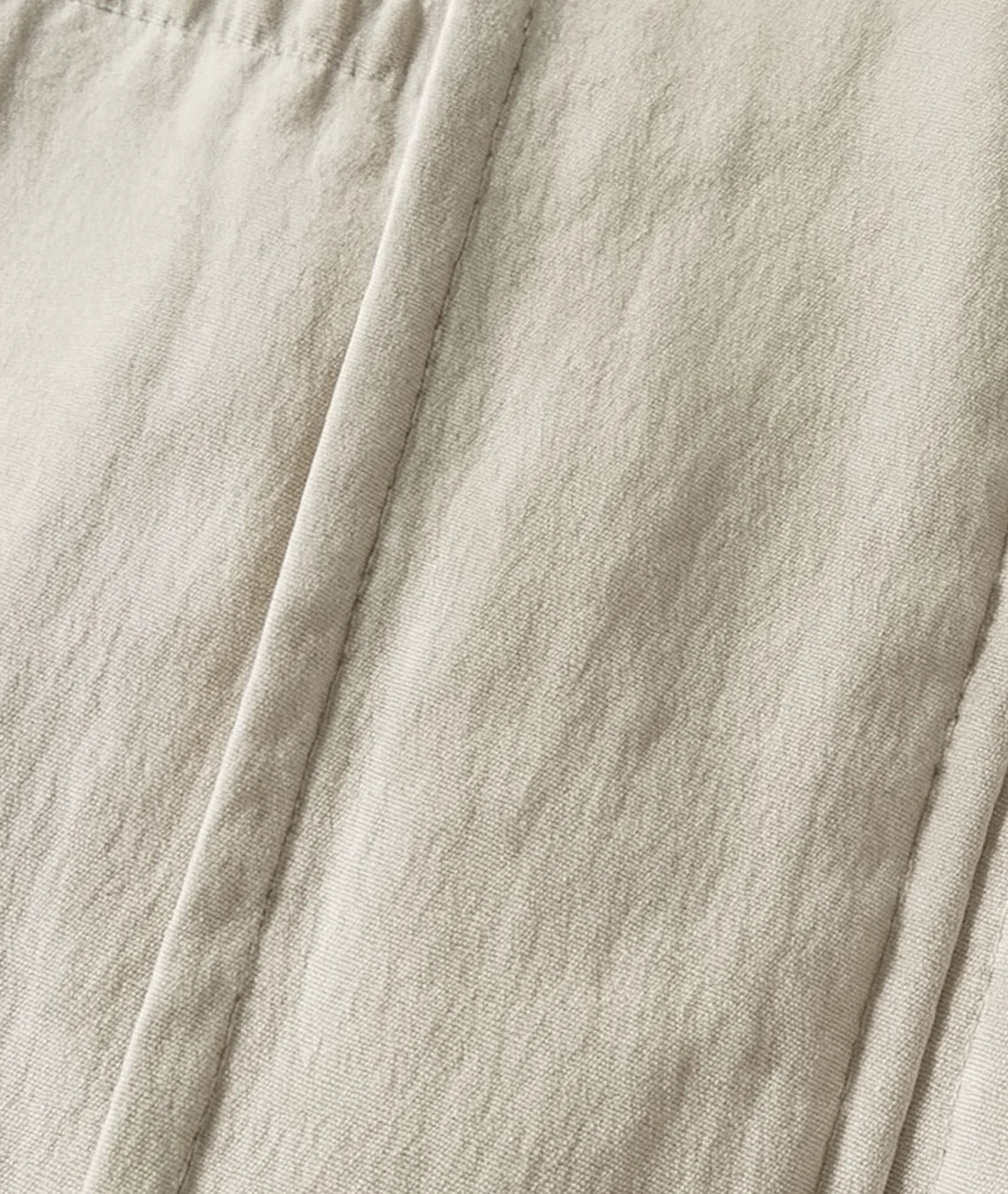 Close-up of beige fabric with folds