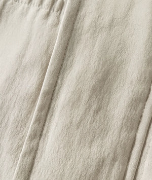 Close-up of beige fabric with folds
